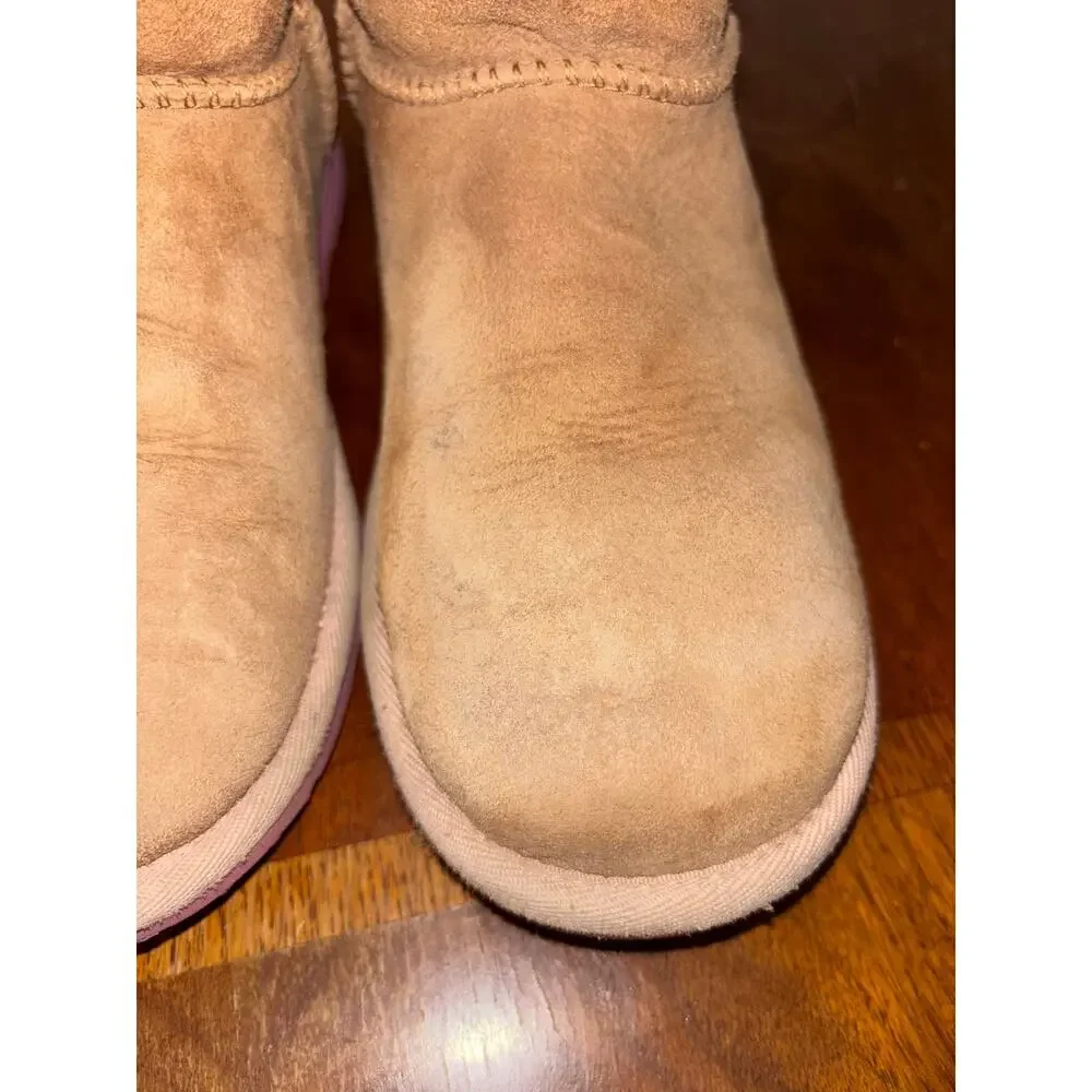 UGG kids’ Bailey Bow II chesnut brown and pink boots with bows on back (size 5)